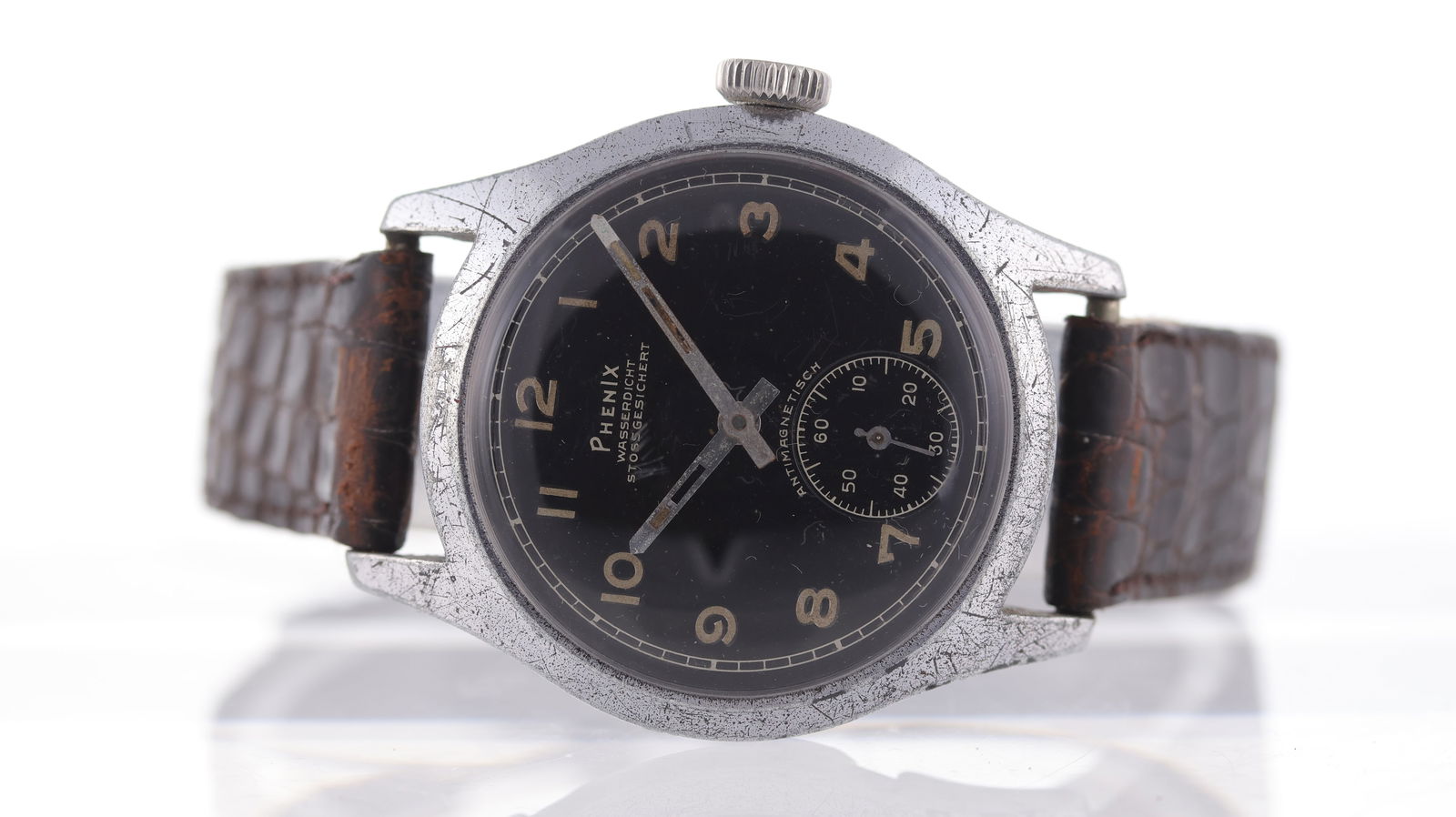 Vintage Phenix DH German Military WWII Circa 1940's: Brand: Phenix Model Name: DH German Military WWII Movement type: Manual Wind Movement calibre: Phenix A.S.1130 Year: Circa 1940's Dial shape: Circular Dial colour: Black Dial features: Arabic numerals
