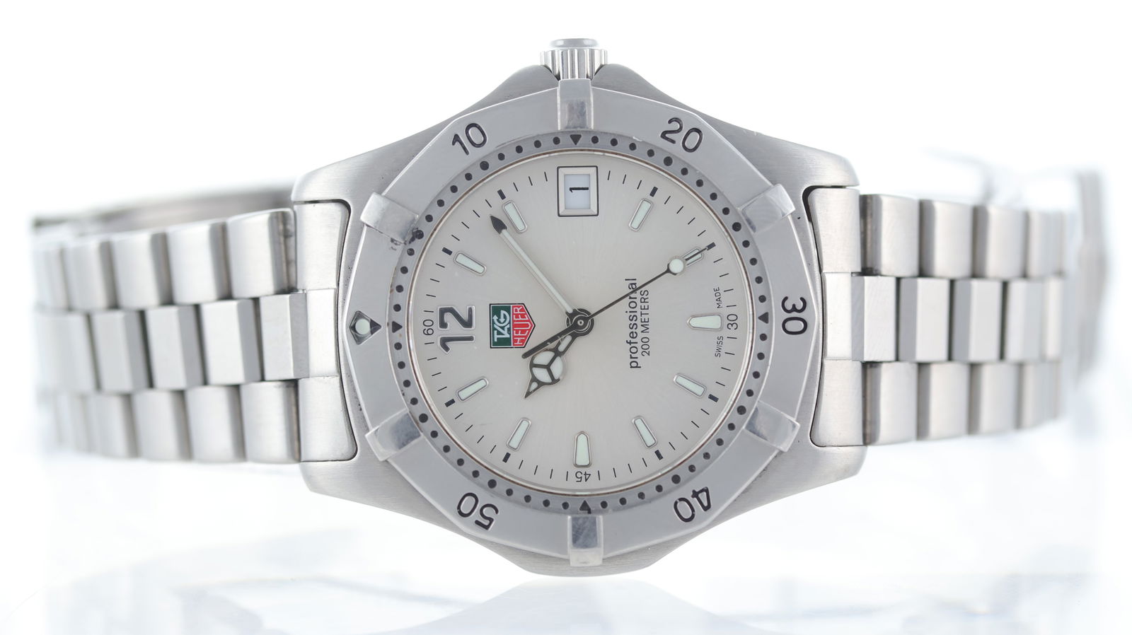 Tag Heuer Professional 200m Ref WK1112-1: Brand: Tag Heuer Model Name: Professional 200m Reference: WK1112-1 Movement type: Quartz Dial shape: Circular Dial colour: Silver Dial features: Baton markers. Mercedes hands and date aperture