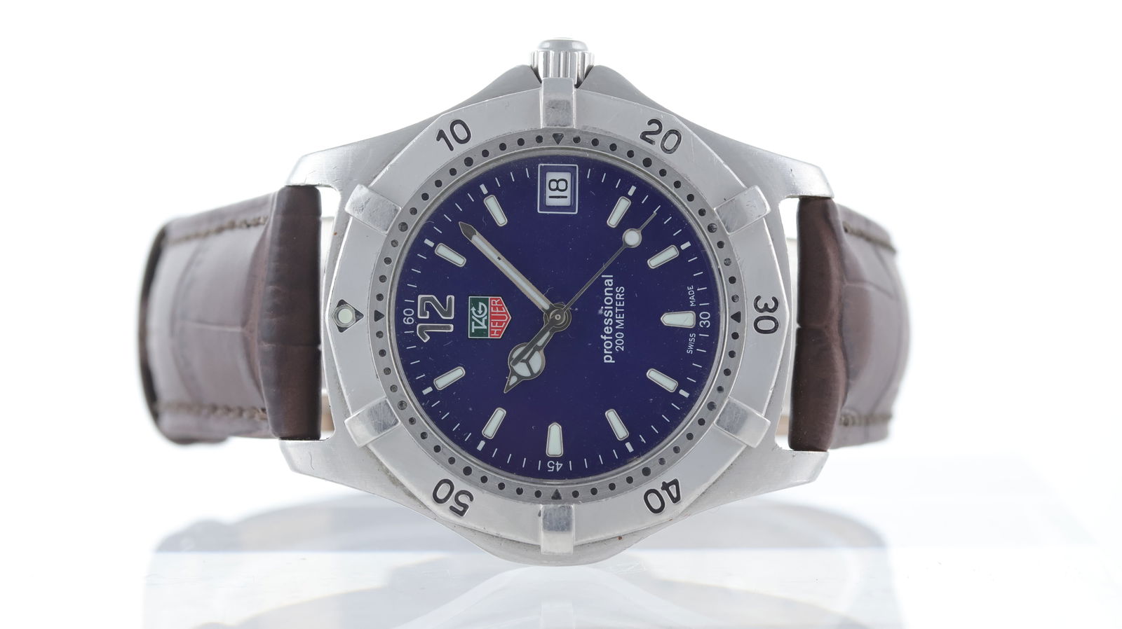 Tag Heuer Professional Ref WK1113-0 2004: Brand: Tag Heuer Model Name: Professional Reference: WK1113-0 Movement type: Quartz Year: 2004 Dial shape: Circular Dial colour: Blue Dial features: Luminous markers and hands, date aperture Bezel: St