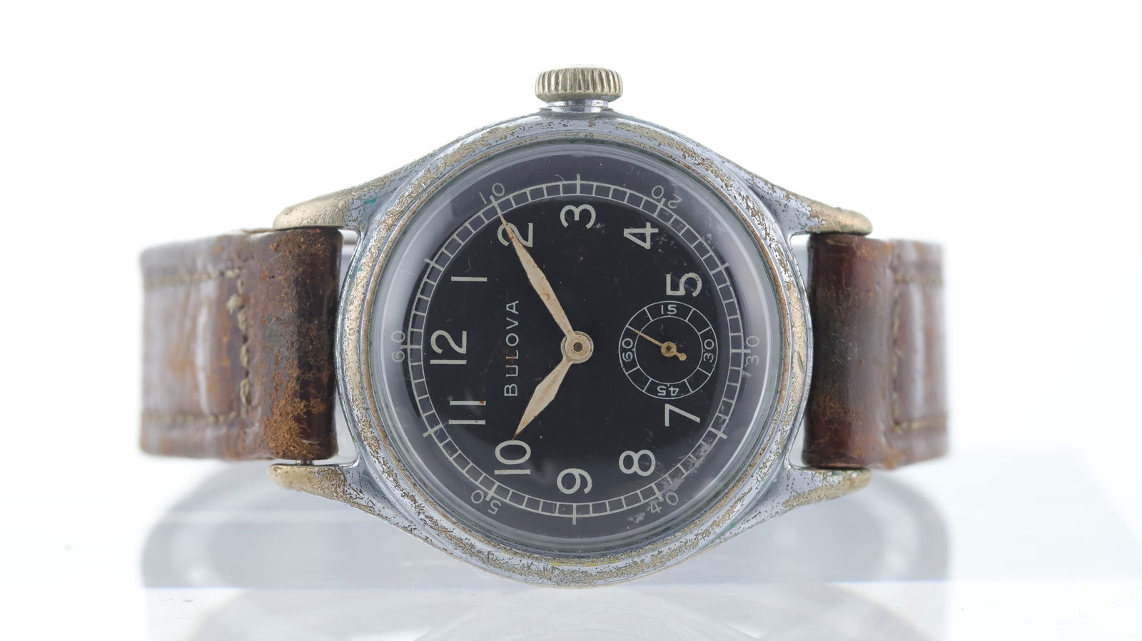 Vintage Bulova Military Style Wristwatch Circa 1940's: Vintage Bulova Military Style Wristwatch Circa 1940's, circular black dial with arabic numerals, subsidiary seconds, rail-road chapter ring with outer 60-minute scale, 32mm chrome-plated case, brown s
