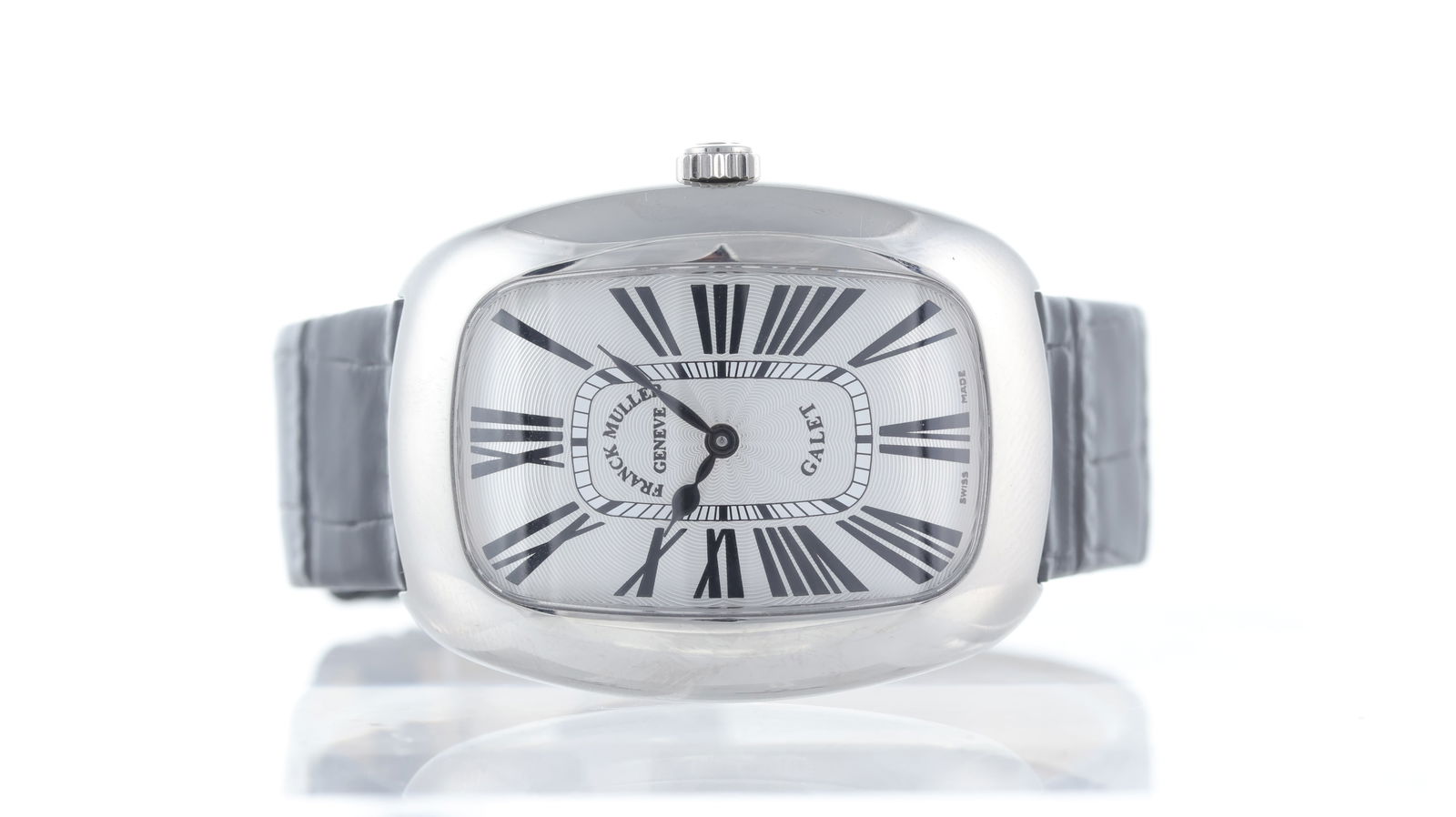 Franck Muller Galet Ref 3002 M QZ R: Brand: Franck Muller Model Name: Galet Reference: 3002 M QZ R Movement type: Quartz Dial shape: Rectangular Dial colour: silver Dial features: Over sized black roman numerals, curved dial Bezel: heavy
