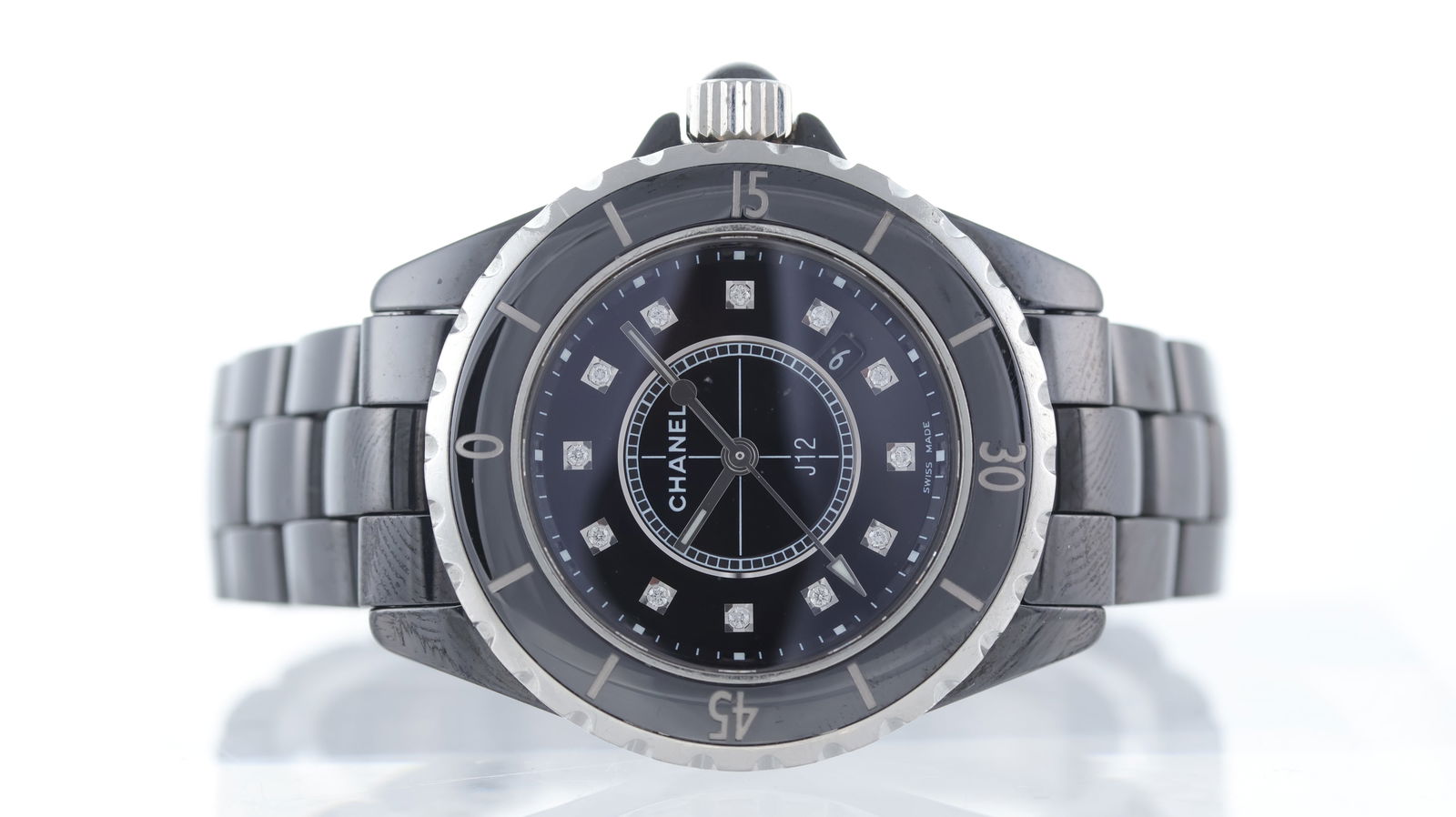 Chanel J12 Quartz: Brand: Chanel Model Name: J12 Movement type: Quartz Dial shape: Circular Dial colour: Black Dial features: Diamond dot hour markers. Date aperture at 4:30 o'clock. Bezel: Uni-directional bezel. Case s
