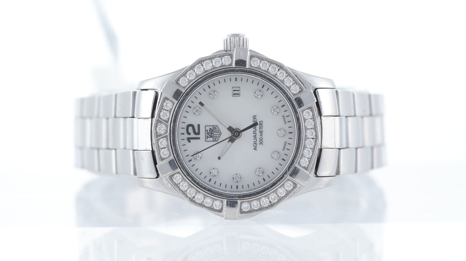 Ladies Tag Heuer Aquaracer Ref WAF1416: Brand: Tag Heuer Model Name: Aquaracer Reference: WAF1416 Movement type: Quartz Dial shape: Circular Dial colour: Mother of Pearl Dial features: Dot diamond hour markers. Quick set date aperture at 3