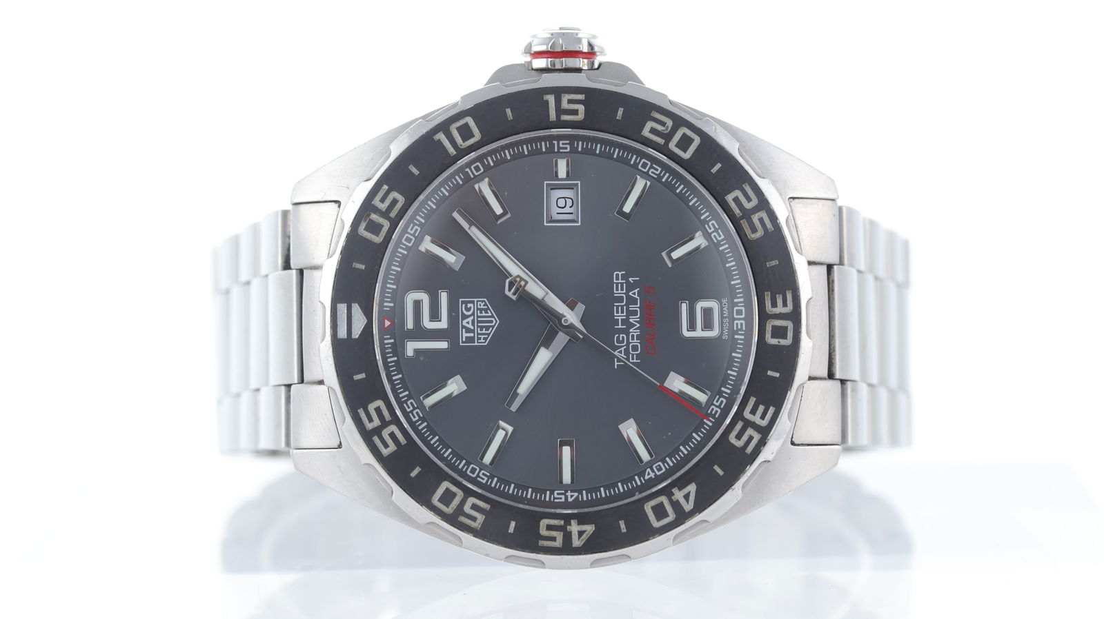 Tag Heuer Formula 1 Automatic Ref WAZ2011: Brand: Tag Heuer Model Name: Formula 1 Reference: WAZ2011 Movement type: Automatic Dial shape: Circular Dial colour: Sunburst, Graphite Dial features: Silver/Lume hands and baton hour markers. Red acc
