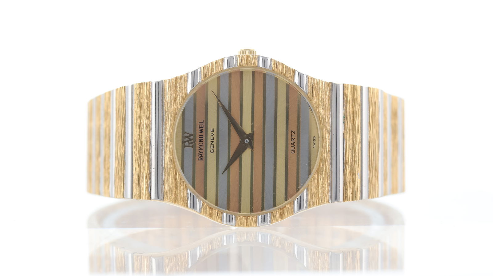 Raymond Weil Polo Ref 9042 with Box Circa 1980's: Brand: Raymond Weil Model Name: Polo Reference: 9042 Movement type: Quartz Year: Circa 1980's Dial shape: Circular Dial colour: Tri-colour Dial features: Tri-colour striped dial Bezel: Textured Case