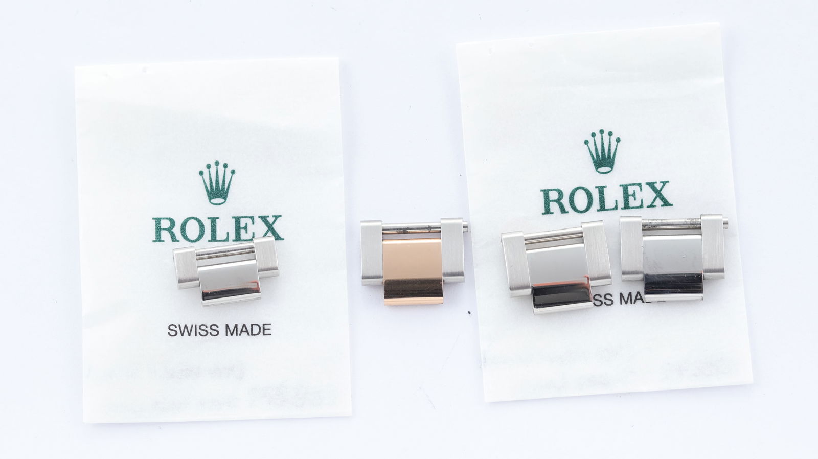 4x Rolex Oyster Bracelet Links: 4x Rolex Oyster Bracelet Links, 1 x steel and rose gold oyster link, 2 x stainless steel oyster links and a 1/2 stainless steel oyster link