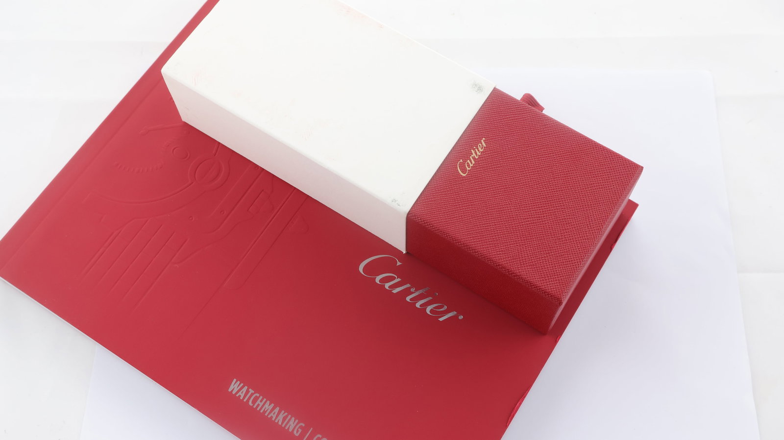 Cartier Care Cleaning Kit & Cartier Booklet: Cartier Care Cleaning Kit & Cartier Booklet, 1 Cartier care cleaning kit with brush, spray and cloth and 1 Cartier watchmaking collection booklet from 2020