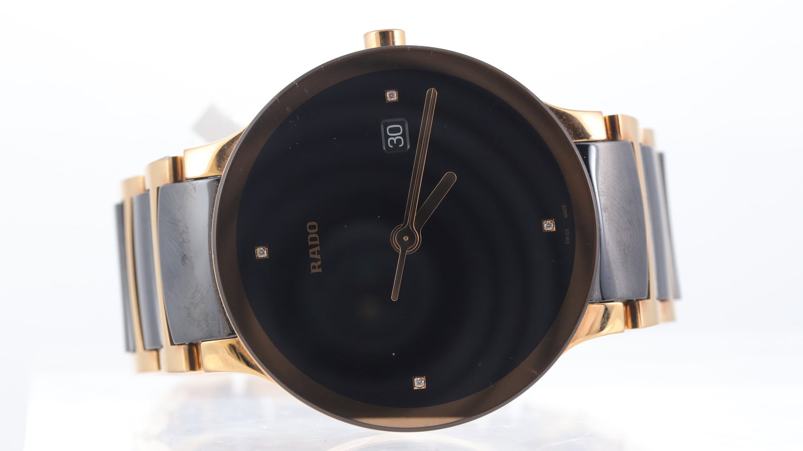Rado Centrix Ref 115.0554.3: Brand: Rado Model Name: Centrix Reference: 115.0554.3 Movement type: Quartz Dial shape: Circular Dial colour: Black Dial features: Diamond set hour markers, date aperture. Rose