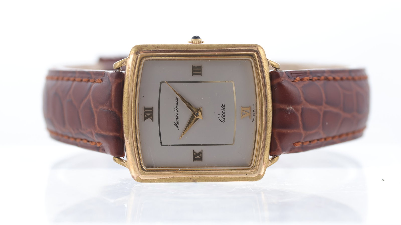 Maurice Lacroix Dress Watch: Brand: Maurice Lacroix Model Name: Dress Watch Movement type: Quartz Dial shape: Square Dial colour: Grey Dial features: Applied roman quarter hour markers Case size: 29mm