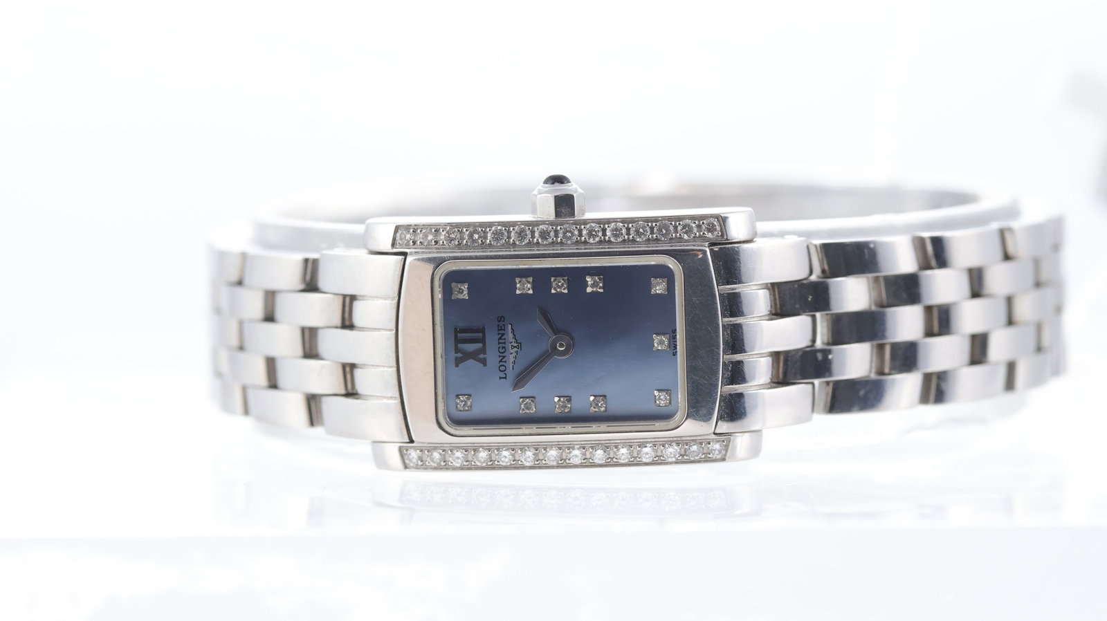 Longines Dolce Vita Ref L5.158.0: Brand: Longines Model Name: Dolce Vita Reference: L5.158.0 Movement type: Quartz Dial shape: Rectangular Dial colour: Blue Mother of Pearl Dial features: Diamond hour markers.