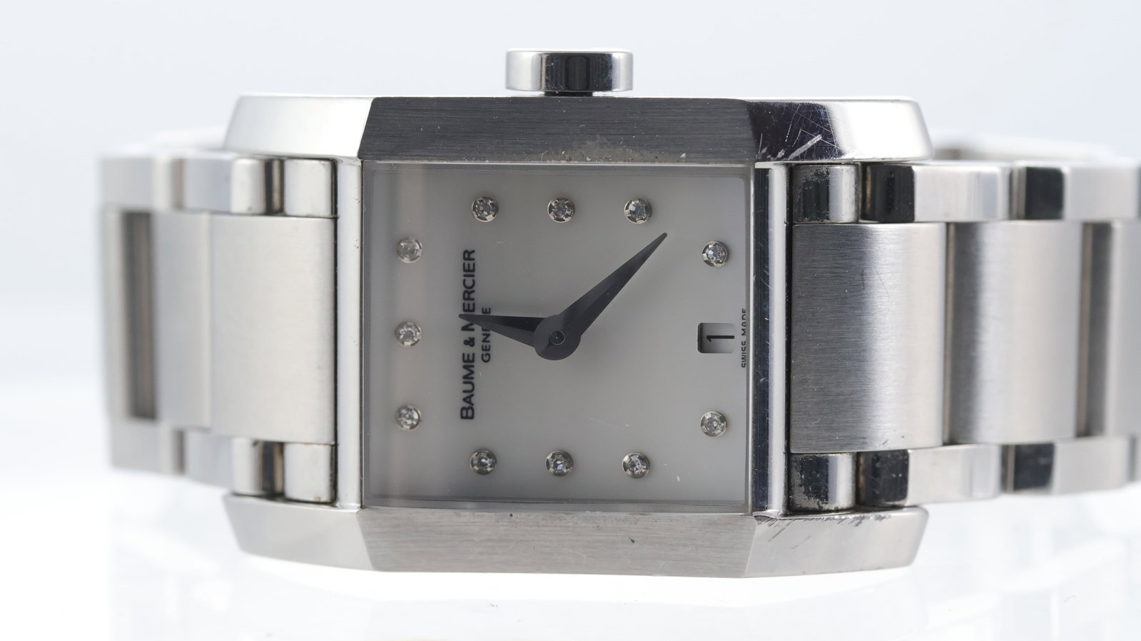 Baume & Mercier Hampton Ref 65488: Brand: Baume & Mercier Model Name: Hampton Reference: 65488 Movement type: Quartz Dial shape: Rectangular Dial colour: Mother of Pearl Dial features: Dot diamond hour markers and a quick set date