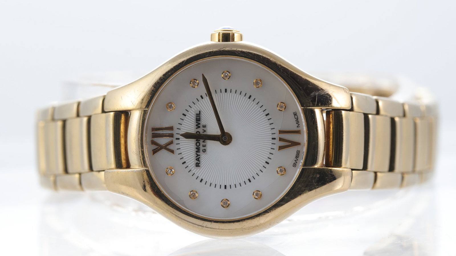 Ladies Raymond Weil Noemia Quartz Ref 5124: Brand: Raymond Weil Model Name: Noemia Reference: 5124 Movement type: Quartz Dial shape: Circular Dial colour: Mother of Pearl Dial features: Gilt hands with stone set hour markers. Guilloche centre