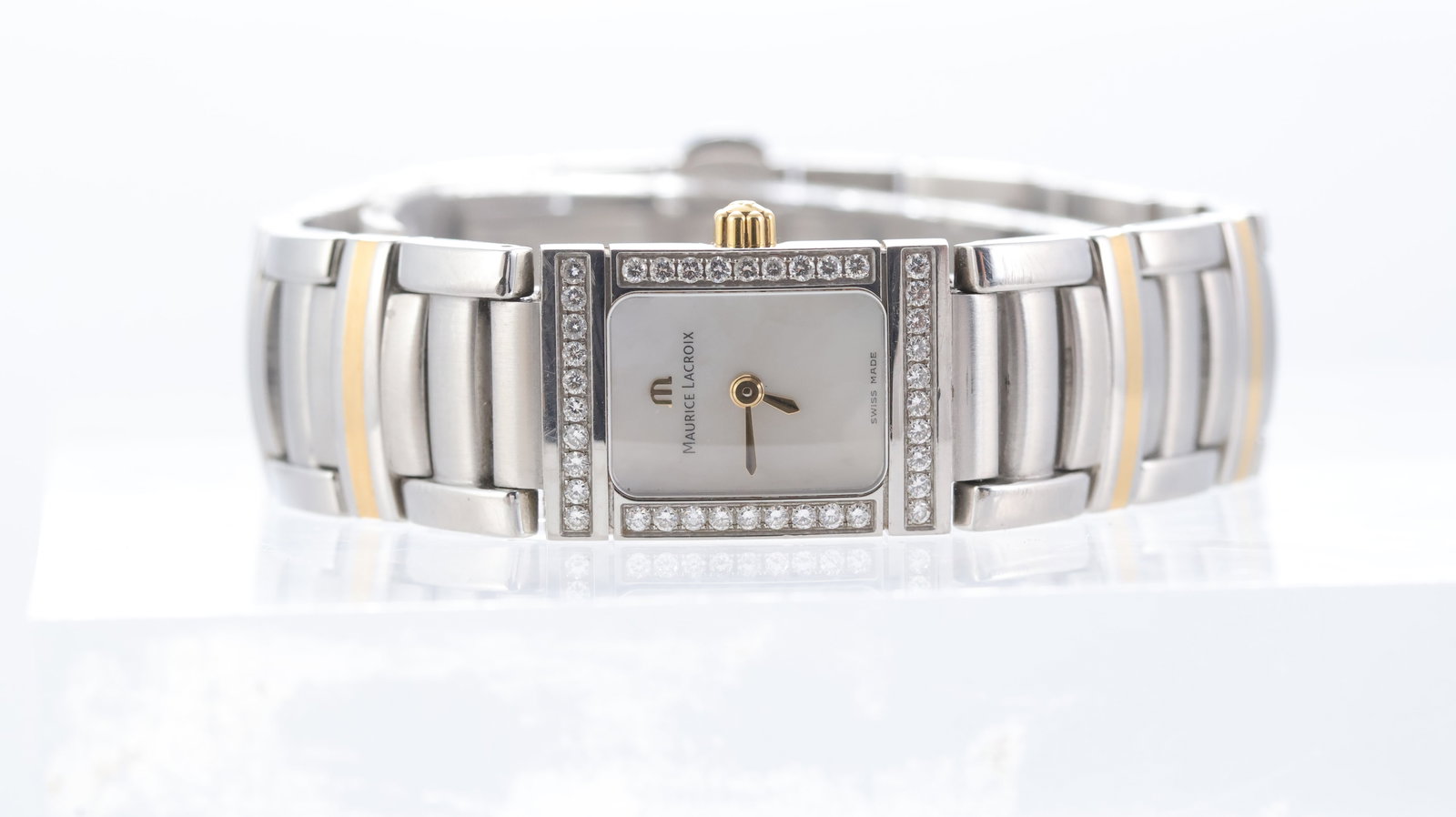 Maurice Lacroix Miros Ref 32823: Brand: Maurice Lacroix Model Name: Miros Reference: 32823 Movement type: Quartz Dial shape: Rectangular Dial colour: Mother of Pearl Dial features: gold hands Bezel: diamond set bezel Case size: 16mm