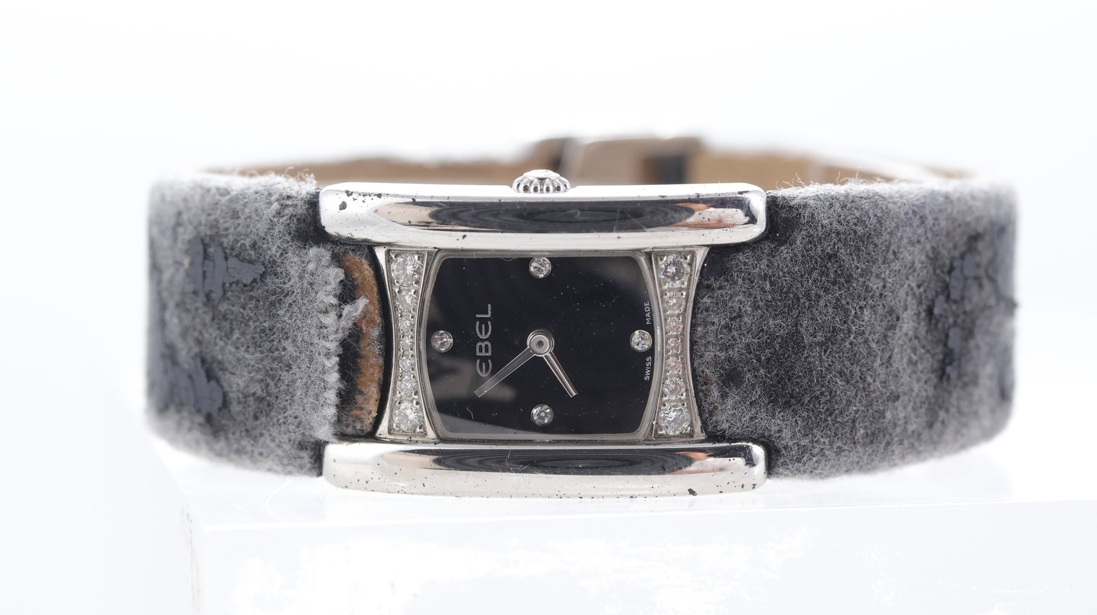 Ebel Beluga Ref E9057A28.30: Brand: Ebel Model Name: Beluga Reference: E9057A28.30 Movement type: Quartz Dial shape: Rectangular Dial colour: Black Dial features: diamond dot hour markers Bezel: