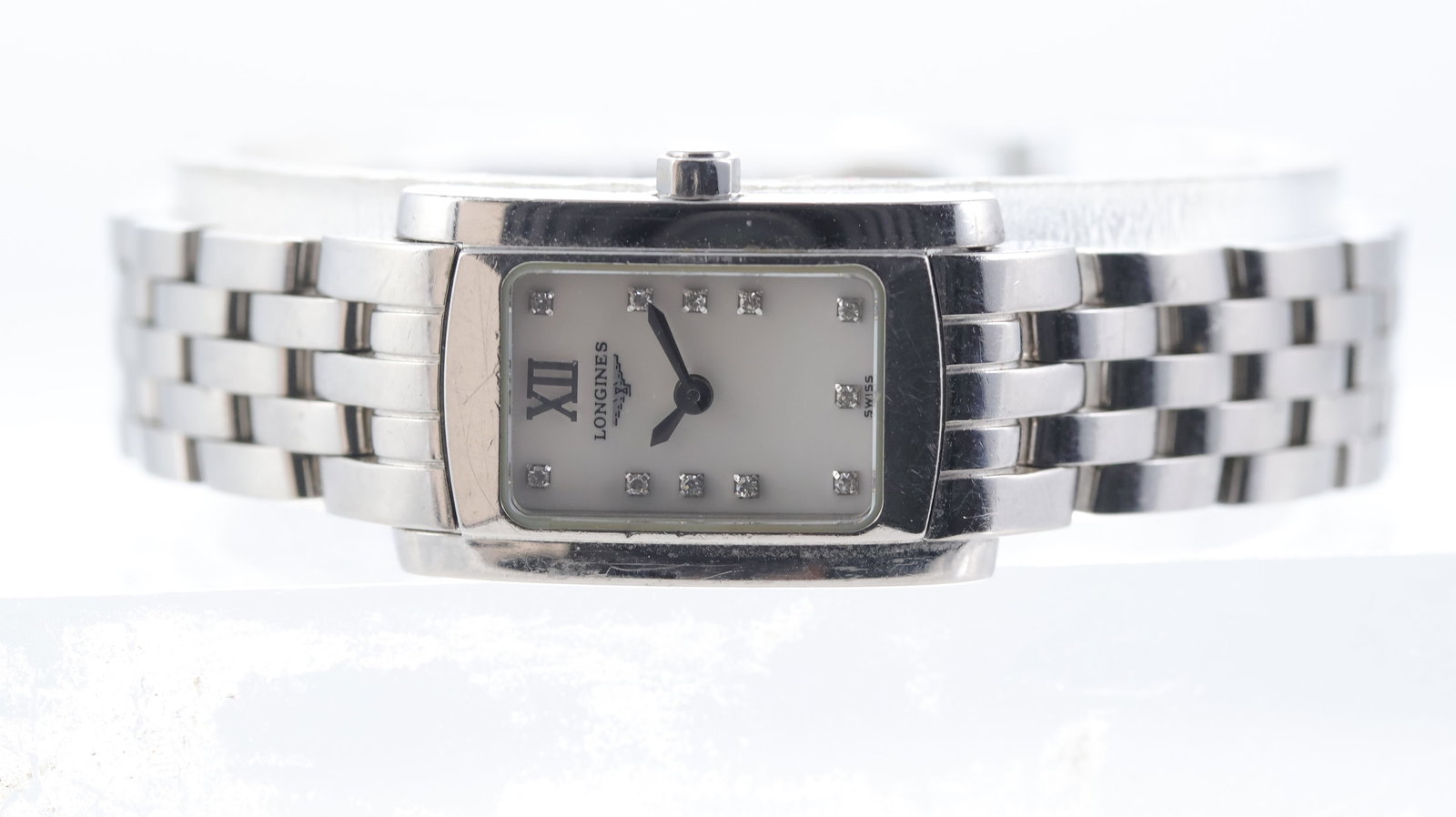 Longines Dolce Vita Ref L51584: Brand: Longines Model Name: Dolce Vita Reference: L51584 Movement type: Quartz Dial shape: Rectangular Dial colour: mother of pearl Dial features: Silver hands and diamond dot hour markers. Case