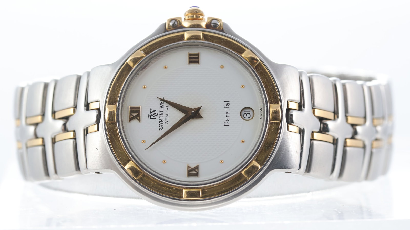Raymond Weil Parsifal Quartz Ref 9190: Brand: Raymond Weil Model Name: Parsifal Reference: 9190 Movement type: Quartz Dial shape: Circular Dial colour: White Dial features: Dauphine hands. Dot and roman numeral hour markers. Date