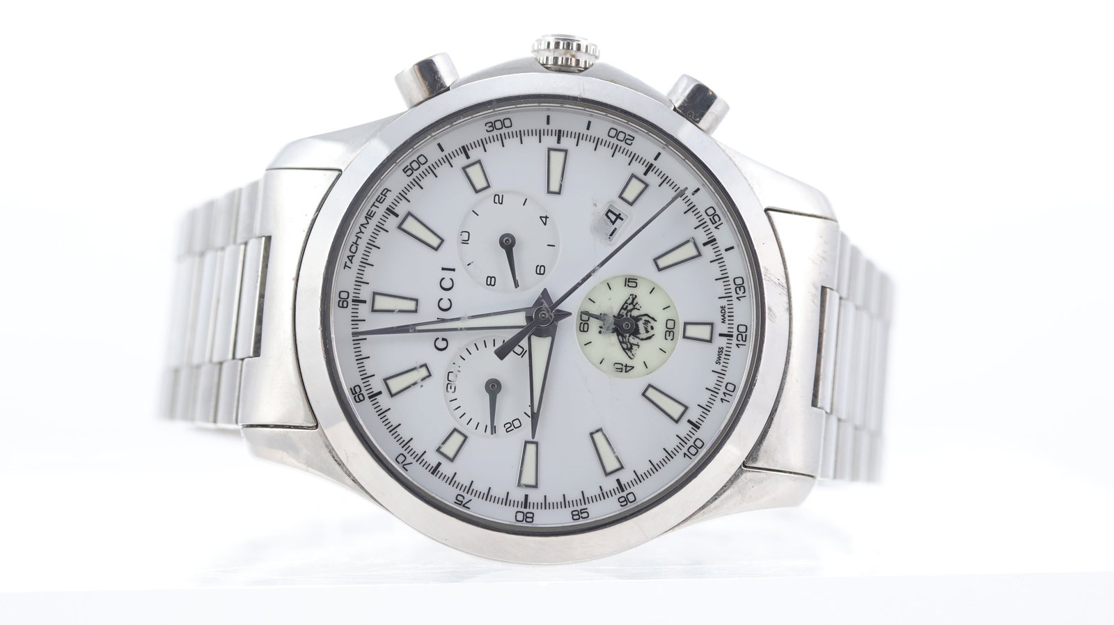 Gucci G Timeless Chronograph Ref 126.4: Brand: Gucci Model Name: G Timeless Reference: 126.4 Movement type: Quartz Dial shape: Circular Dial colour: White Dial features: Lume sub dial. Date aperture. Bezel: Smooth Case size: 39mm Case