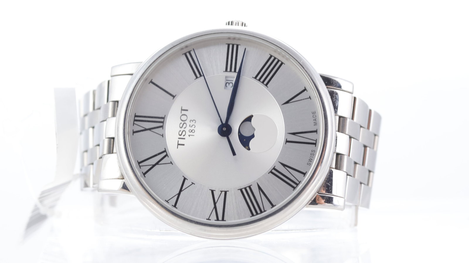 Tissot Carson Ref T122423A Moonphase: Brand: Tissot Model Name: Carson Reference: T122423A Movement type: Quartz Dial shape: Circular Dial colour: Silver Dial features: Roman numerals, quickset date aperture at 3 o'clock, moonphase at 6