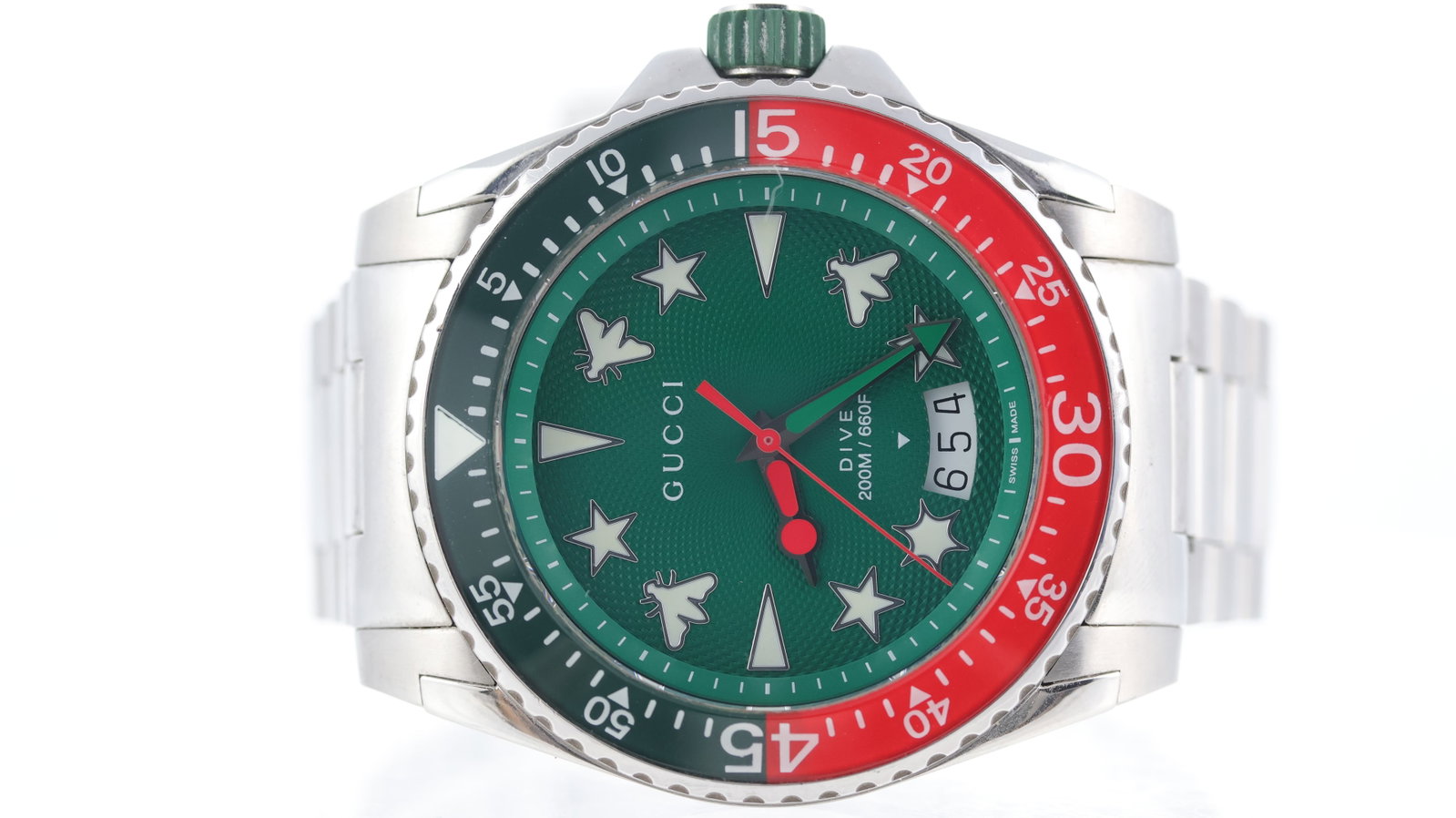 Gucci Dive Ref 136.2: Brand: Gucci Model Name: Dive Reference: 136.2 Movement type: Quartz Dial shape: Circular Dial colour: Green Dial features: Green guilloche dial with gucci symbols as hour markers. Panorama date
