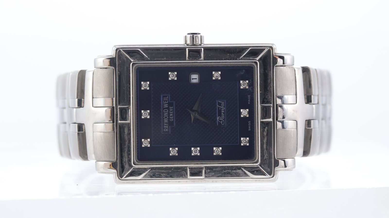 Raymond Weil Parsifal Ref 9331: Brand: Raymond Weil Model Name: Parsifal Reference: 9331 Movement type: Quartz Dial shape: Rectangular Dial colour: Blue Dial features: Guilloche centre. Dot diamond hour marke