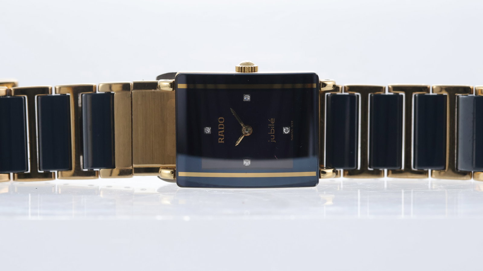 Rado Diastar Ref 153.0383.3: Brand: Rado Model Name: Diastar Reference: 153.0383.3 Movement type: Quartz Dial shape: Rectangular Dial colour: Black Dial features: Gold hands and quarter hour markers Case size: 18mm Case