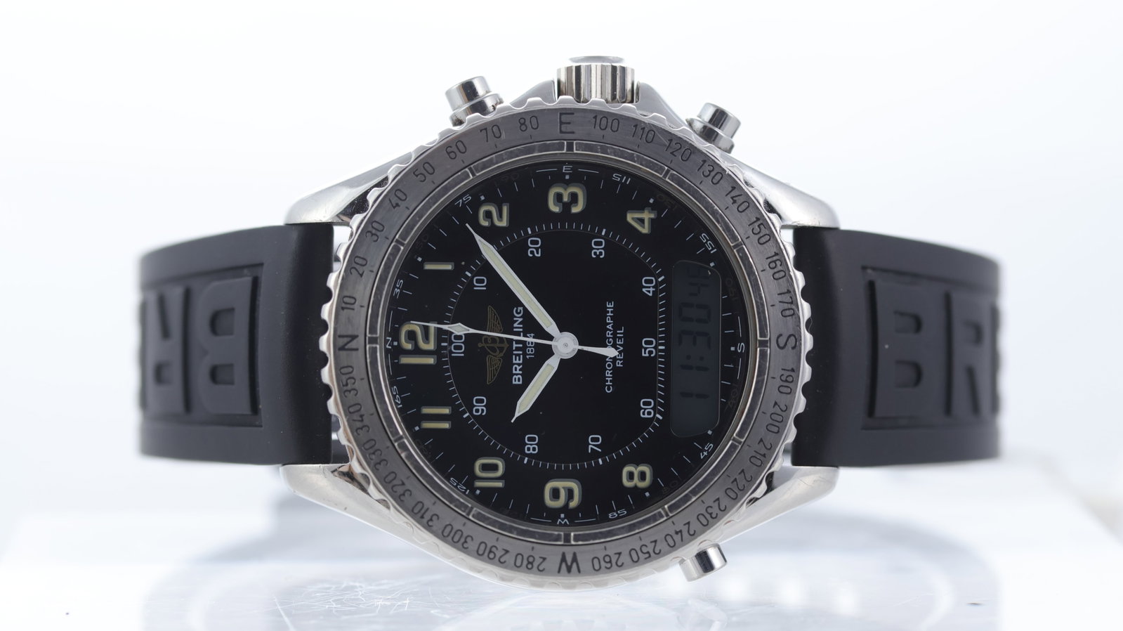 Breitling Intruder Reveil Ref A51035: Brand: Breitling Model Name: Intruder Reveil Reference: A51035 Movement type: Quartz Dial shape: Circular Dial colour: Sunburst black Dial features: Lume arabic numeral hour markers, digital display. 
