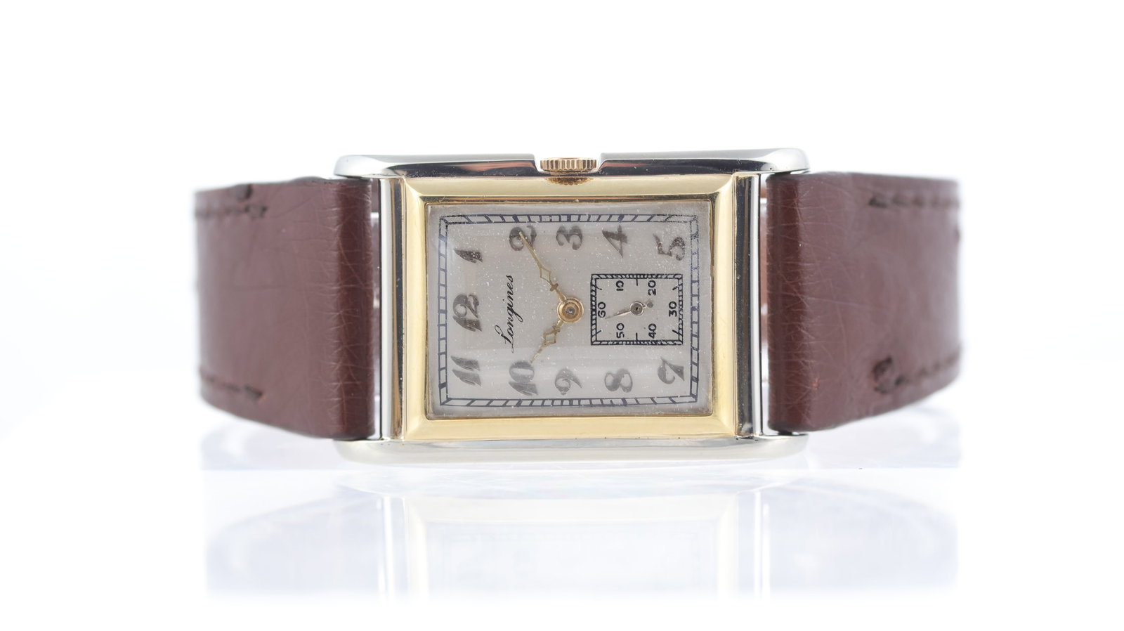 Rare Longines 'Tank' Style Art Deco 18ct Two Colour Gold Circa 1928: Brand: Longines Model Name: 'Tank' Style Art Deco Wristwatch Movement type: Manual Wind Movement calibre: Longines 8.28 Year: Circa 1928 Dial shape: Rectangular Dial colour: Silver Dial features: Breg