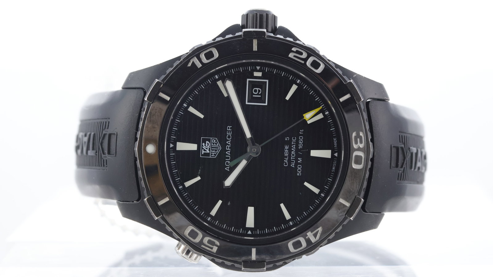 Tag Heuer Aquaracer PVD Ref WAK2180: Brand: Tag Heuer Model Name: Aquaracer Reference: WAK2180 Movement type: Automatic Movement calibre: Sellita SW 200-1 Dial shape: Circular Dial colour: Black Dial features: Sword hands, applied trapez