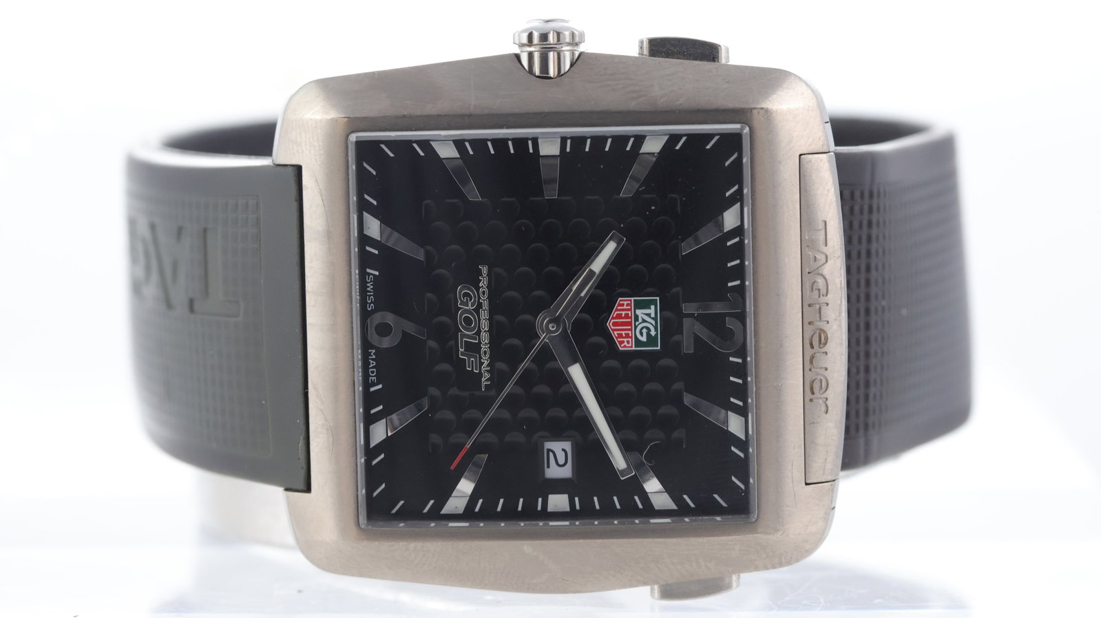 Tag Heuer Golf Tiger Woods Edition Ref WAE1111-0: Brand: Tag Heuer Model Name: Golf Tiger Woods Edition Reference: WAE1111-0 Movement type: Quartz Dial shape: Square Dial colour: Black Dial features: Golf ball textured centre. Baton hour markers. Dat