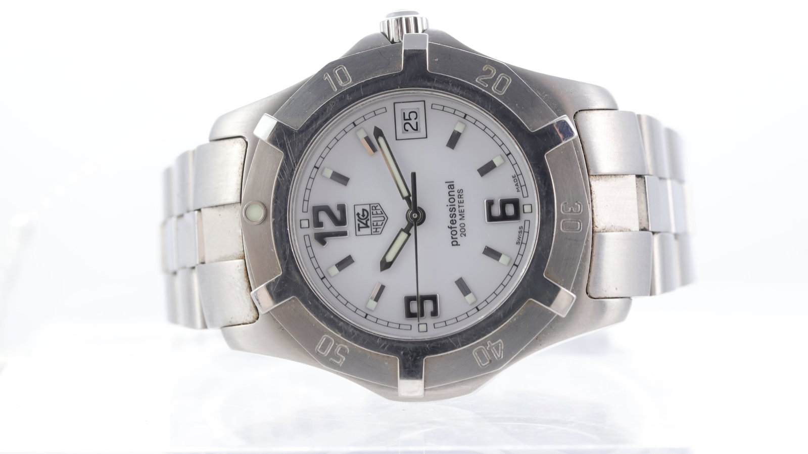 Tag Heuer Professional 200m Ref WN1111: Brand: Tag Heuer Model Name: Professional 200m Reference: WN1111 Movement type: Quartz Dial shape: Circular Dial colour: White Dial features: Baton and arabic numerals, quickset date aperture at 3 o'c