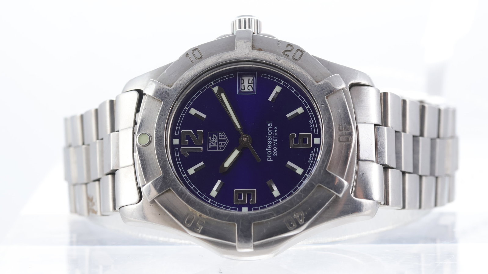 Tag Heuer Professional Ref WN1112: Brand: Tag Heuer Model Name: Professional Reference: WN1112 Movement type: Quartz Dial shape: Circular Dial colour: Sunburst, Blue Dial features: Lume filled hands with silver baton/arabic numeral hou