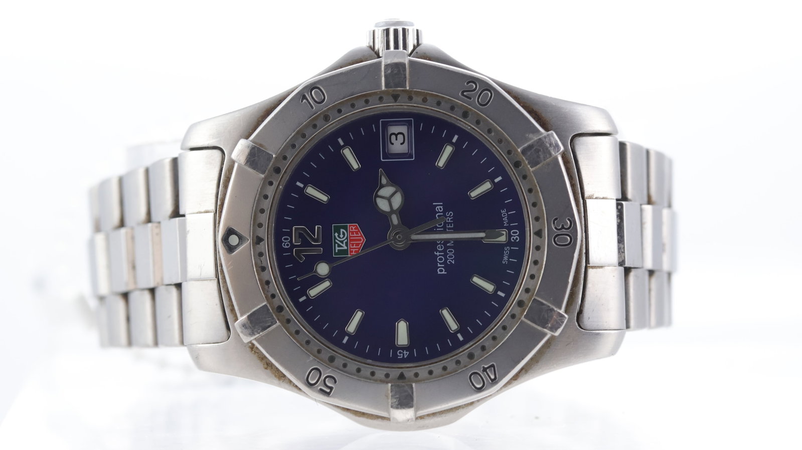 Tag Heuer Professional 200m Ref WK1213-0: Brand: Tag Heuer Model Name: Professional 200m Reference: WK1213-0 Movement type: Quartz Dial shape: Circular Dial colour: Blue Dial features: Mercedes hands. Quick set date aperture at 3 o'clock. Bez