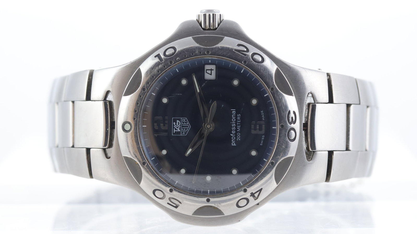 Tag Heuer Kirium Ref WL111F: Brand: Tag Heuer Model Name: Kirium Reference: WL111F Movement type: Quartz Dial shape: Circular Dial colour: Sunburst, Blue Dial features: Applied hour markers. Date aperture at 3 o'clock. Bezel: