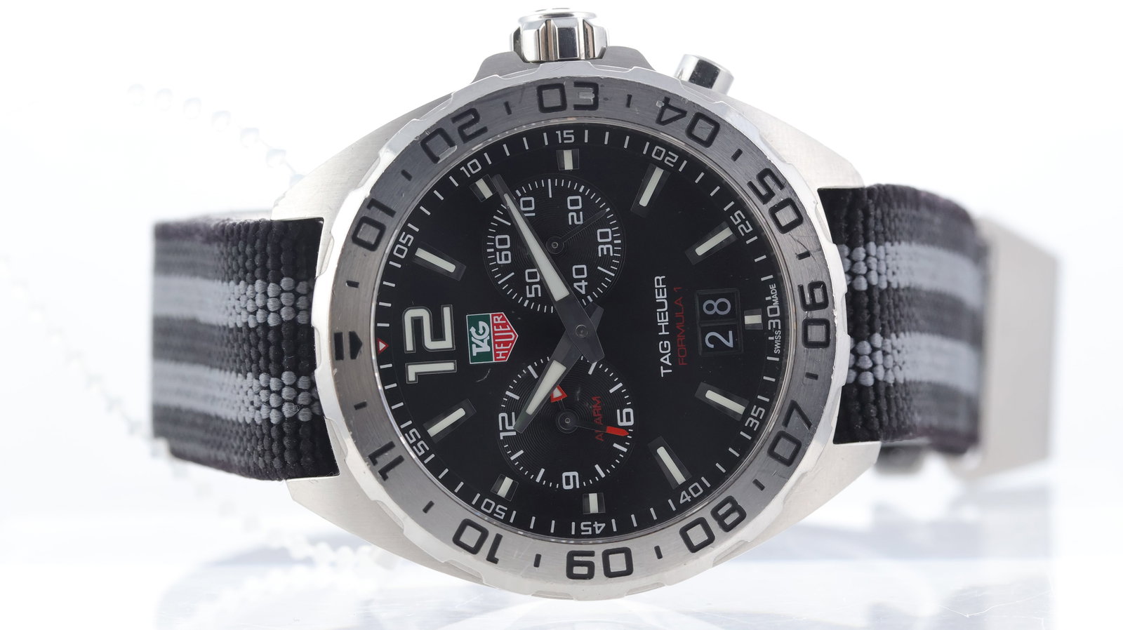 Tag Heuer Formula 1 Alarm Ref WAZ111A: Brand: Tag Heuer Model Name: Formula 1 Alarm Reference: WAZ111A Movement type: Quartz Movement calibre: Tag Heuer Ronda 4120.B Dial shape: Circular Dial colour: Black Dial features: Twin sub dials,