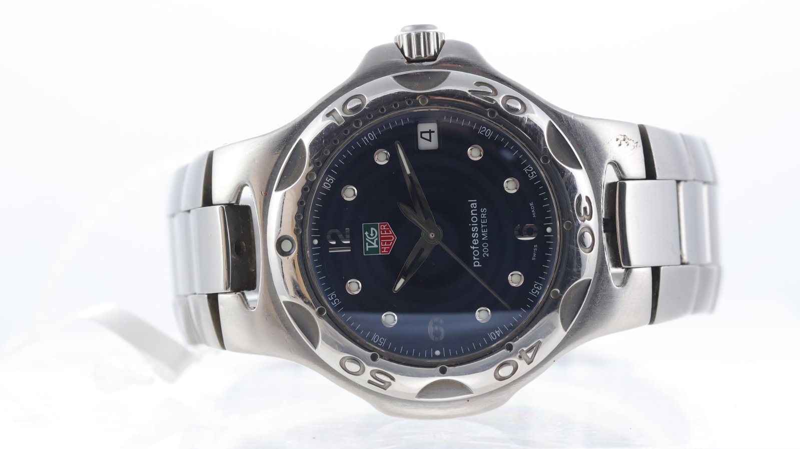 Tag Heuer Kirium Ref WL1113-0: Brand: Tag Heuer Model Name: Kirium Reference: WL1113-0 Movement type: Quartz Dial shape: Circular Dial colour: Sunburst, Blue Dial features: Lume dot and arabic numeral hour markers. Date aperture