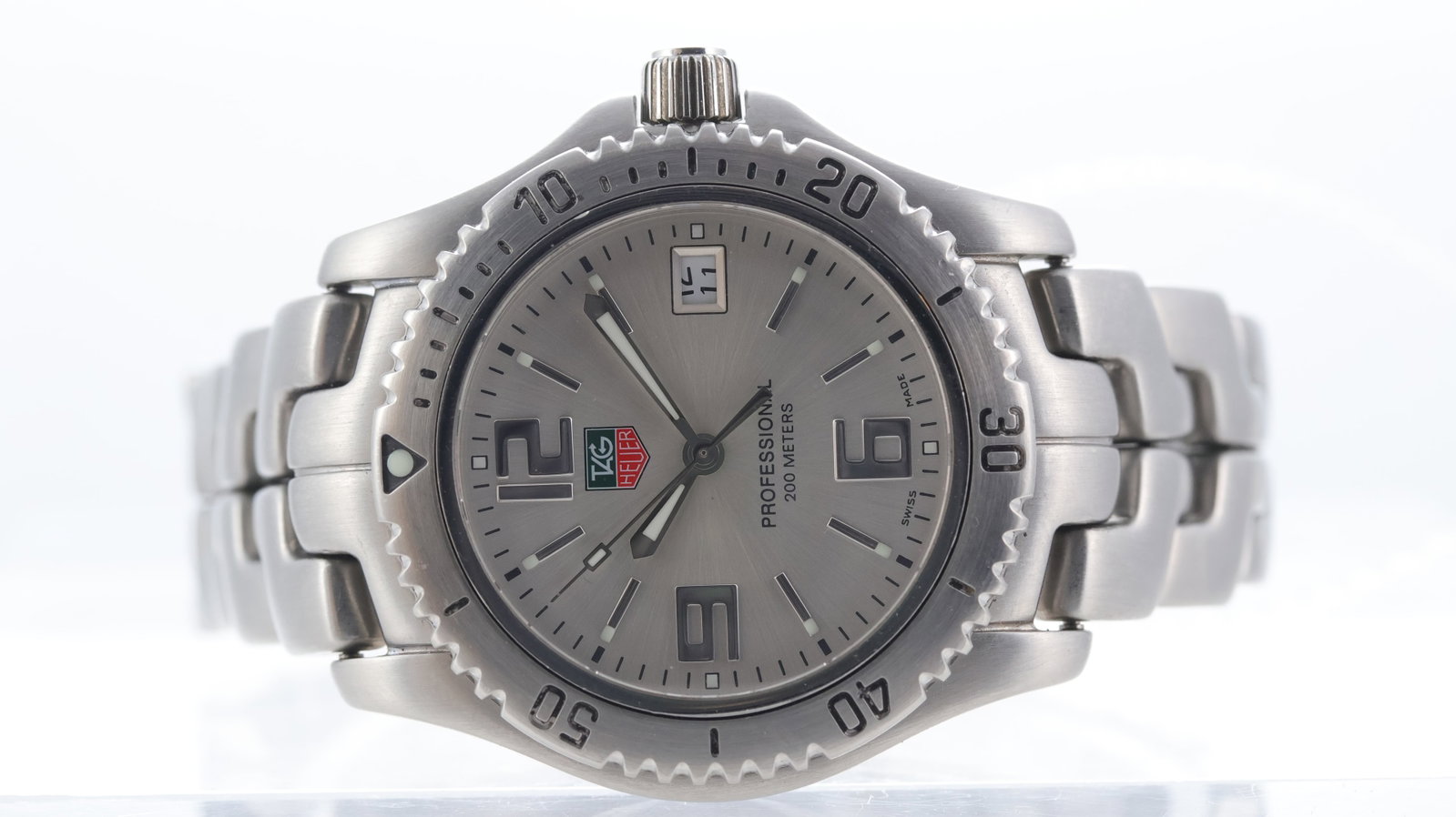 Tag Heuer Link Professional Ref WT1212: Brand: Tag Heuer Model Name: Link Professional Reference: WT1212 Movement type: Quartz Dial shape: Circular Dial colour: Silver Dial features: Silver arabic numeral and baton hour markers. Date