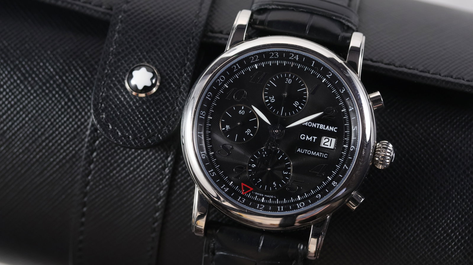 Montblanc Star GMT Chronograph Ref 7067 with Watch Roll: Brand: Montblanc Model Name: Star GMT Reference: 7067 Movement type: Automatic Movement calibre: Montblanc 4810.503 Box: Travel pouch Dial shape: Circular Dial colour: Black Dial features: Guilloche t