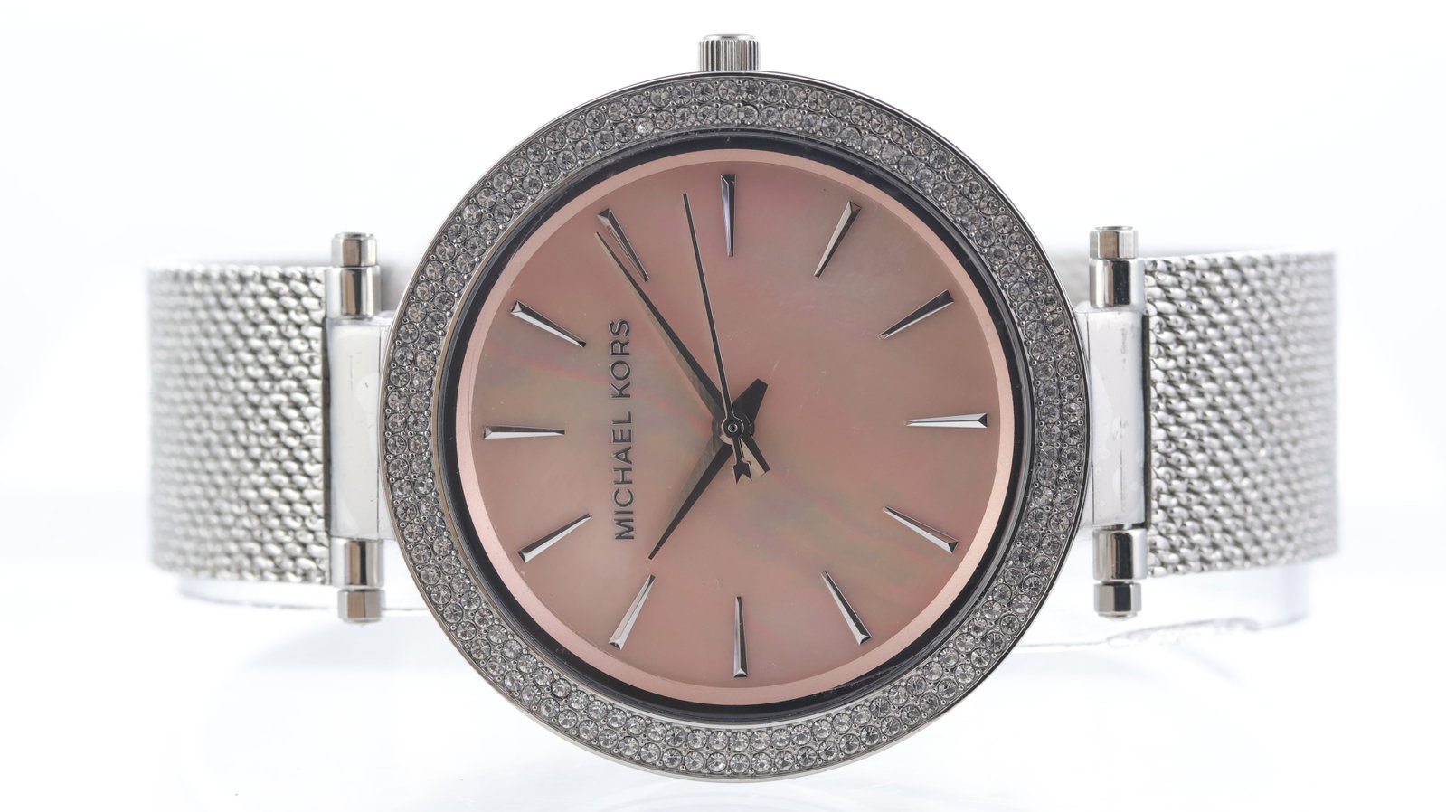 Michael Kors Watch Ref MK-4518: Brand: Michael Kors Model Name: Watch Reference: MK-4518 Movement type: Quartz Dial shape: Circular Dial colour: Pink mother of pearl Dial features: Baton hour markers Bezel: Stone set bezel Case