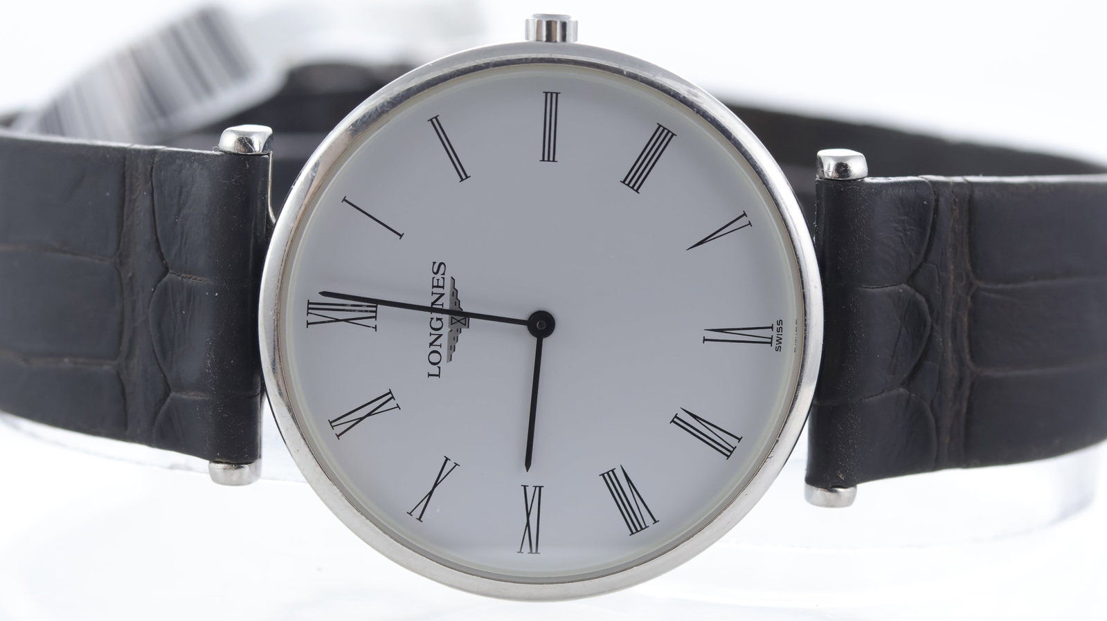 Longines La Grande Classique Quartz Ref L4.709.4: Brand: Longines Model Name: La Grande Classique Reference: L4.709.4 Movement type: Quartz Dial shape: Circular Dial colour: White Dial features: Black roman numeral hour markers. Bezel: Smooth Case