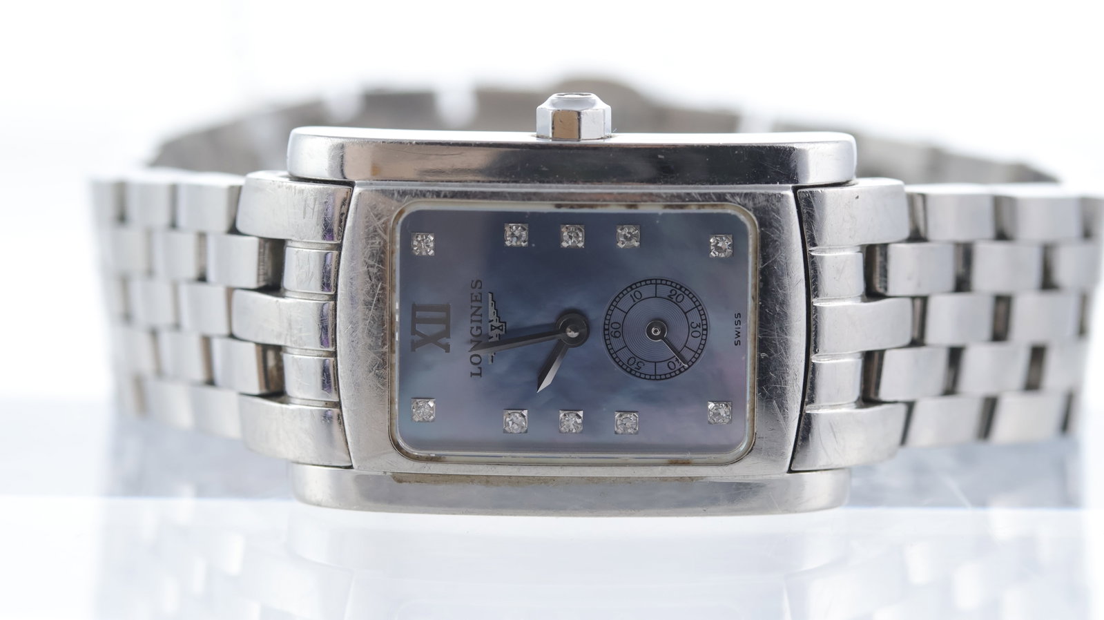 Longines Dolce Vita Ref L5.155.4: Brand: Longines Model Name: Dolce Vita Reference: L5.155.4 Movement type: Quartz Dial shape: Rectangular Dial colour: Blue Mother of Pearl Dial features: Diamond hour markers, subsidiary seconds Case