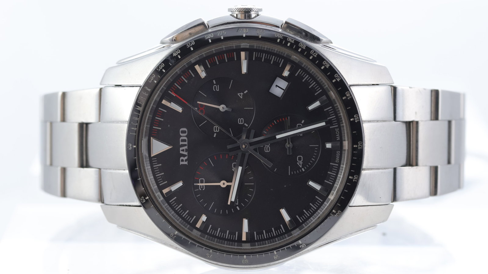 Rado Hyperchrome Quartz Chronograph Ref 312.0259.3: Brand: Rado Model Name: Hyperchrome Reference: 312.0259.3 Movement type: Quartz Dial shape: Circular Dial colour: Dark Grey Dial features: Applied silver hour markers. Red accents. Date aperture at 4