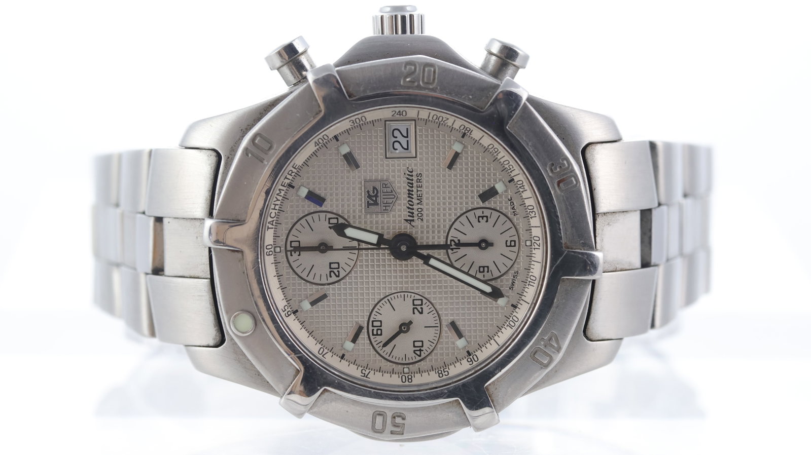 Tag Heuer 200 meters Ref CN2110-0: Brand: Tag Heuer Model Name: 200 meters Reference: CN2110-0 Movement type: Automatic Dial shape: Circular Dial colour: Silver Dial features: Applied baton markers. Date aperture at 3 o'clock. Bezel: