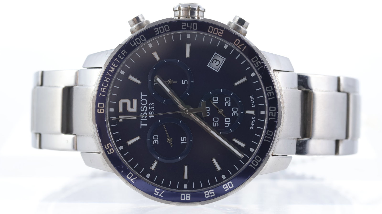 Tissot Quickster Ref T095417A: Brand: Tissot Model Name: Quickster Reference: T095417A Movement type: Quartz Dial shape: Circular Dial colour: Blue Dial features: Baton hour markers, three sub dials, date aperture at 4 o'clock