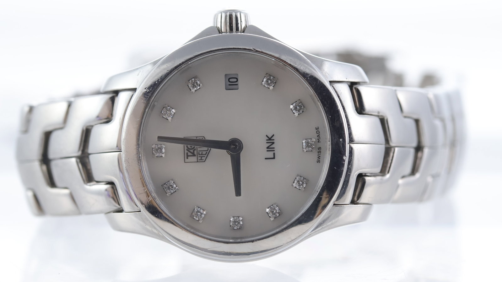 Tag Heuer Link Ref WJF1414: Brand: Tag Heuer Model Name: Link Reference: WJF1414 Movement type: Quartz Dial shape: Circular Dial colour: Mother of pearl Dial features: Diamond dot hour markers, quickset date aperture at 3
