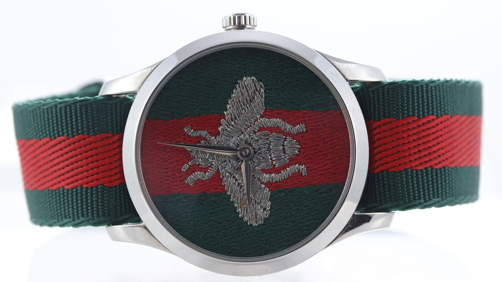 Gucci G Timeless Ref 126.4: Brand: Gucci Model Name: G Timeless Reference: 126.4 Movement type: Quartz Dial shape: Circular Dial colour: Fabric Dial features: Gucci Bee fabric dial Bezel: Polished Case size: 38mm Case material: