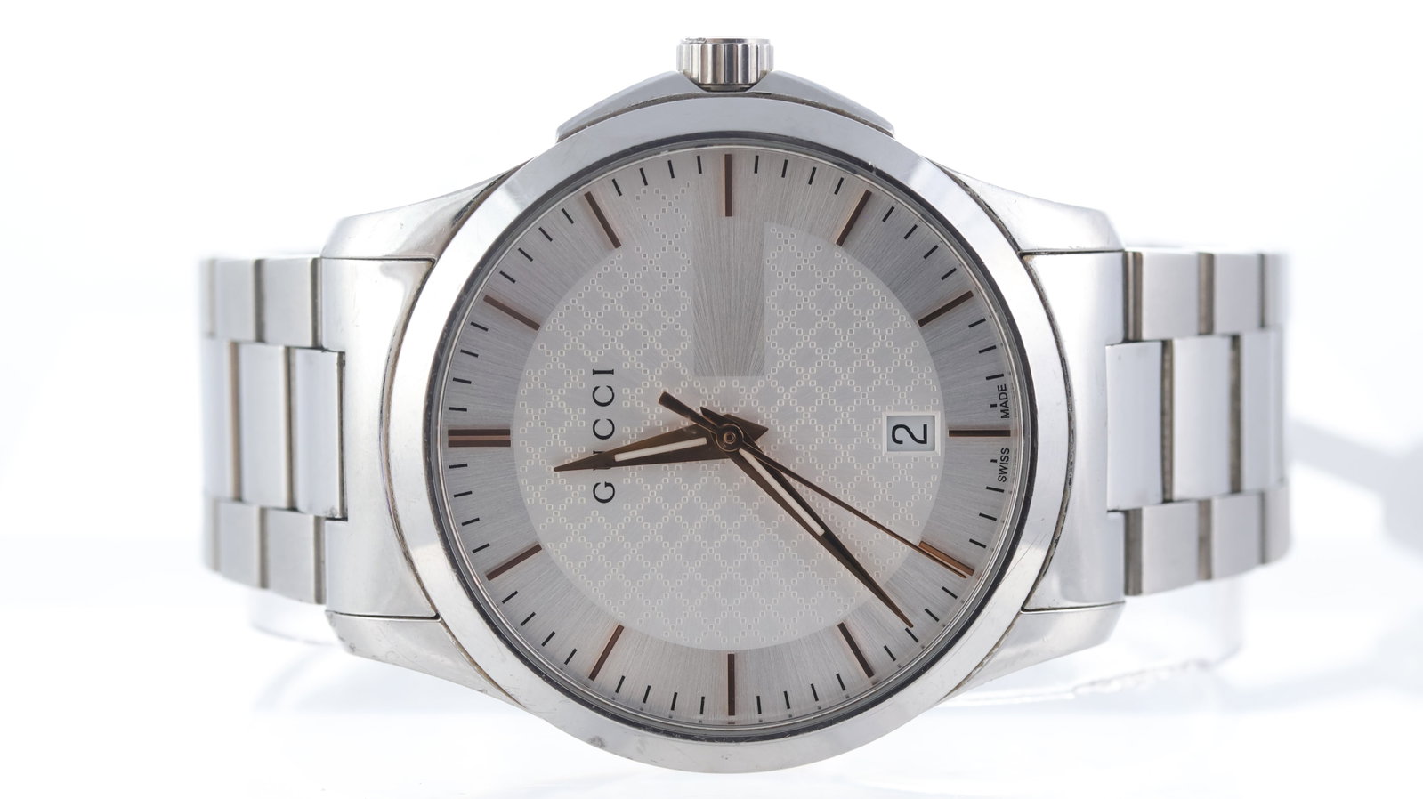 Gucci G Timeless Ref 126.4: Brand: Gucci Model Name: G Timeless Reference: 126.4 Movement type: Quartz Dial shape: Circular Dial colour: Silver Dial features: Lume filled hands with silver hour markers. Date aperture at 6