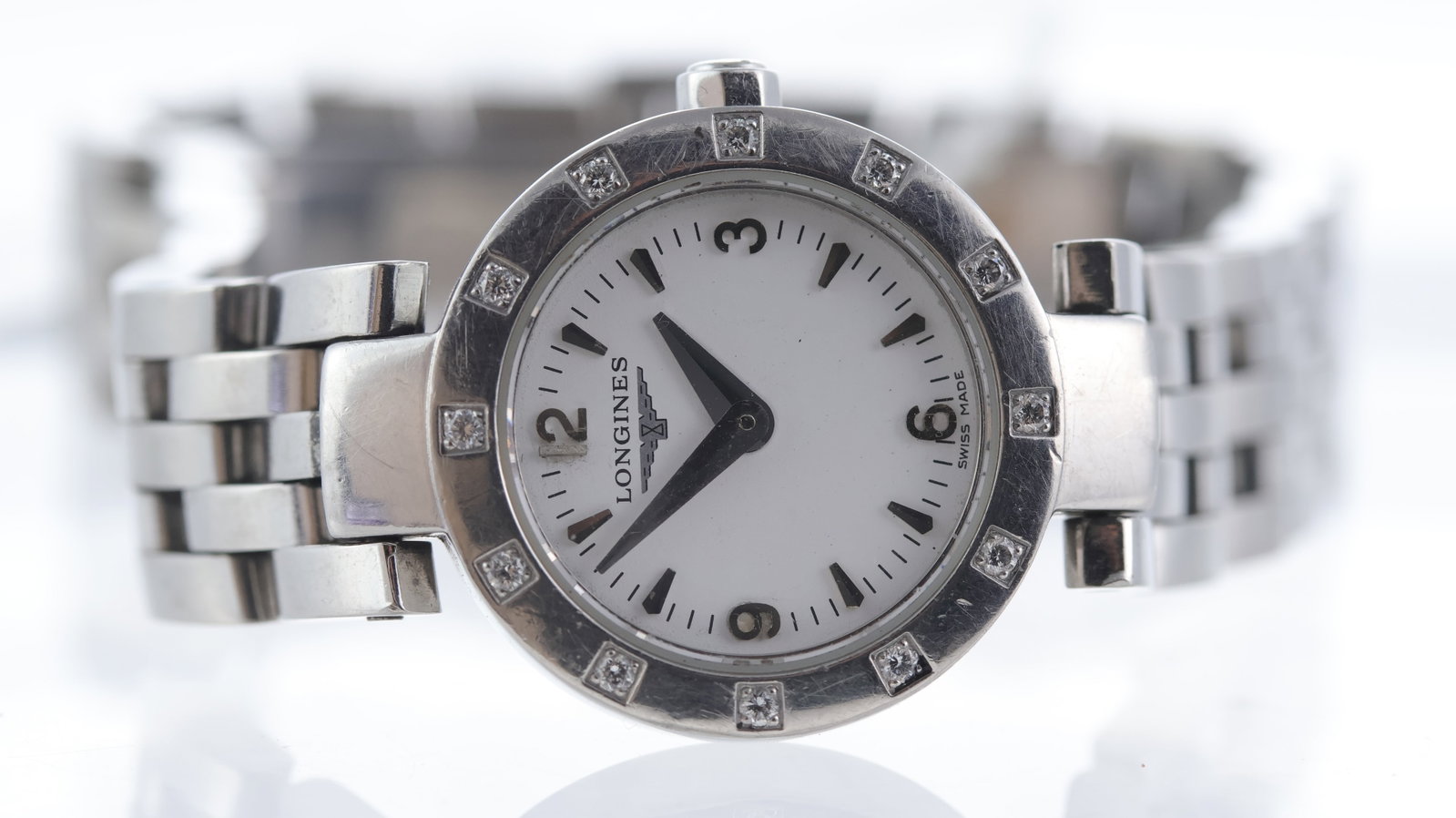 Longines Dolce Vita Ref L5.174.0: Brand: Longines Model Name: Dolce Vita Reference: L5.174.0 Movement type: Quartz Dial shape: Circular Dial colour: White Dial features: Arabic and baton hour markers Bezel: Diamond set Case size: