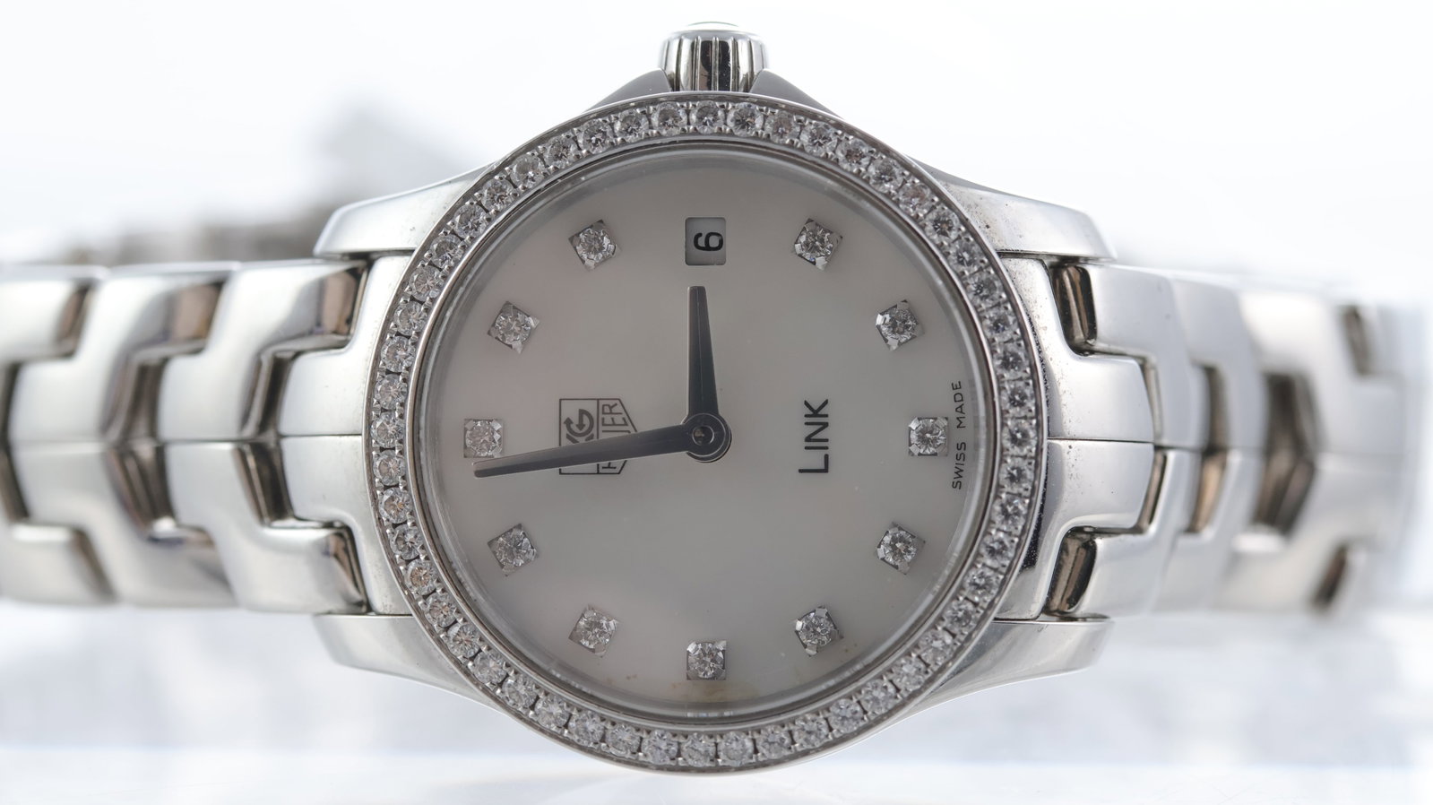 Tag Heuer Link Ref WJF1417: Brand: Tag Heuer Model Name: Link Reference: WJF1417 Movement type: Quartz Dial shape: Circular Dial colour: Mother of pearl Dial features: Diamond dot hour markers, quickset date aperture at 3