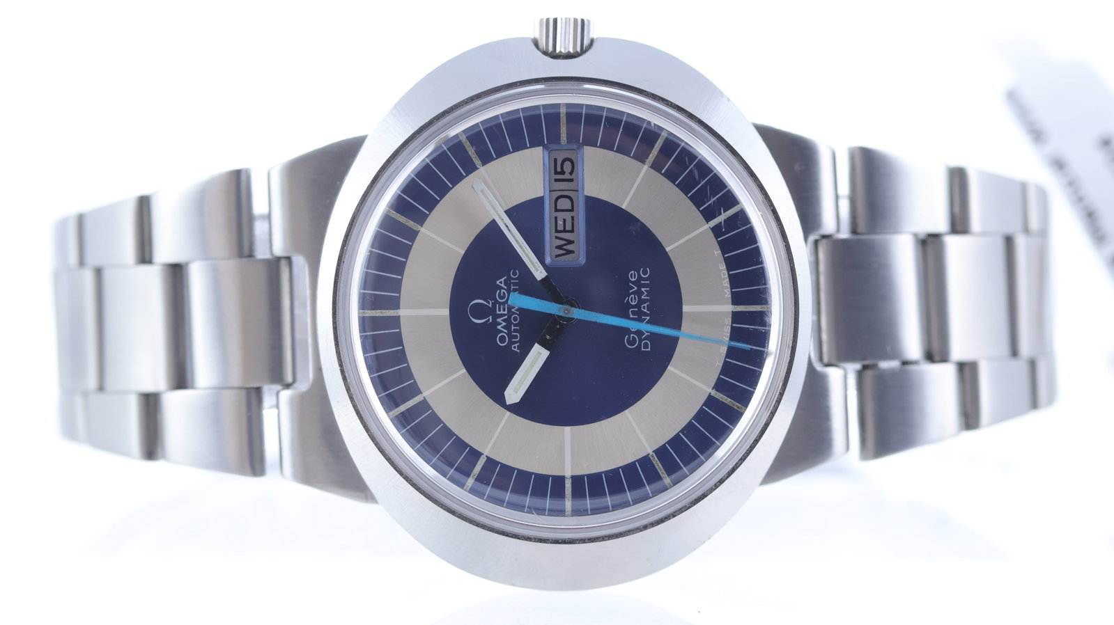 Omega Dynamic Day Date Circa 1970's: Brand: Omega Model Name: Dynamic Movement type: Automatic Year: Circa 1970's Dial shape: Circular Dial colour: Silver and blue Dial features: Day and date aperture at 3 o'clock Bezel: Brushed finish C