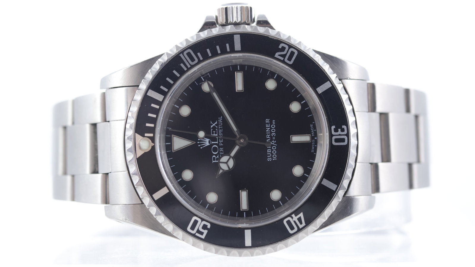 Rolex Submariner Ref 14060M Circa 2003: Brand: Rolex Model Name: Submariner Reference: 14060M Movement type: Automatic Movement calibre: Rolex 3130 Year: Circa 2003 Dial shape: Circular Dial colour: Black Dial features: Two line dial, merce